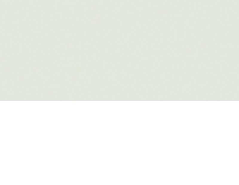 Nahaufnahme eines weißen, gepunkteten Musters auf grauem Hintergrund