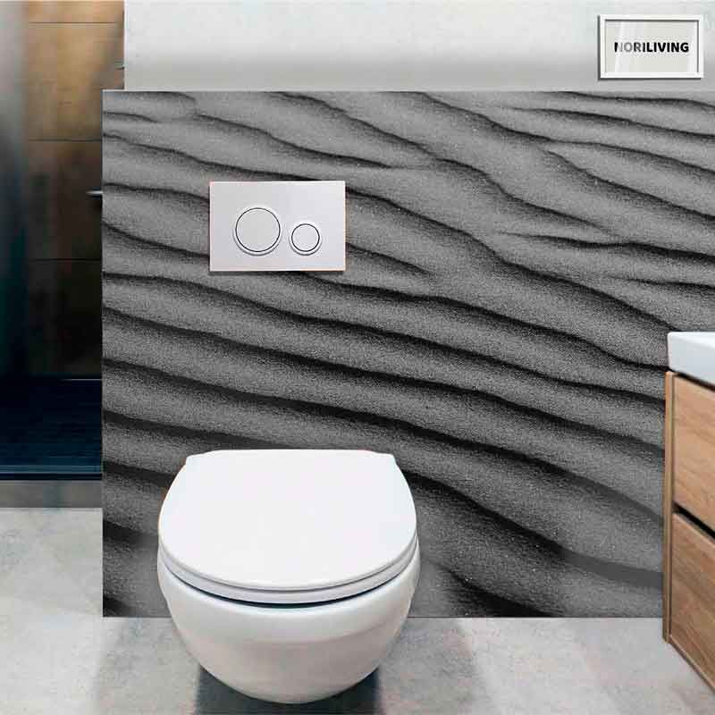 Moderne Toilette vor einer grauen Wand mit wellenförmigem Design und dualem Spülsystem