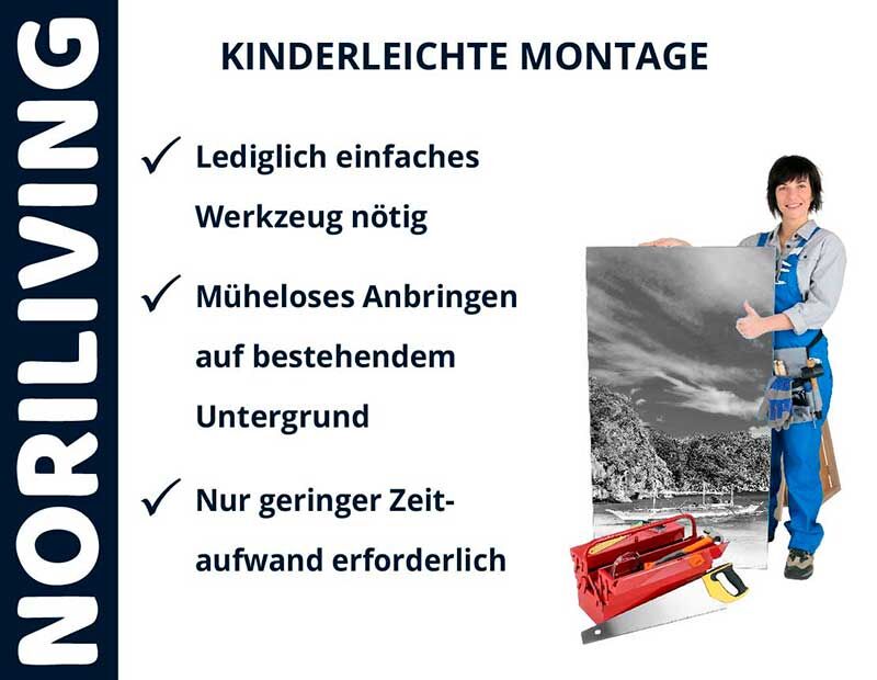 Frau in blauer Arbeitskleidung zeigt einfache Montage von Wandbild mit Werkzeug.
