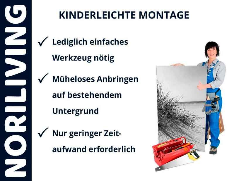 Person in Arbeitskleidung präsentiert Montagewerkzeug und eine Montageanleitung mit der Aufschrift 'Kinderleichte Montage' von Noriliving