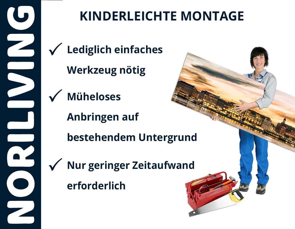 Person zeigt einfach montierbares Wandbild von Noriliving mit Werkzeug im Vordergrund