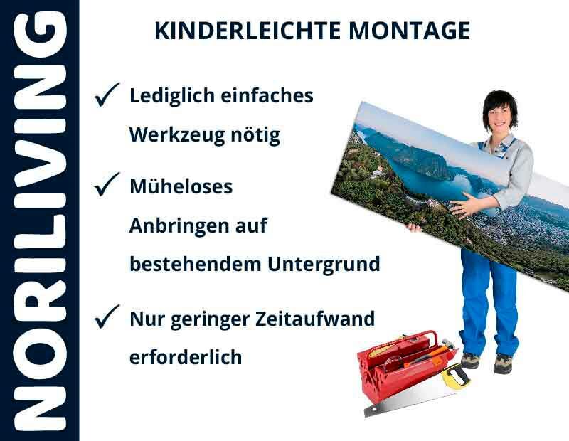 Frau zeigt auf einfach zu montierendes Noriliving-Bild mit wenig Werkzeug und Zeitaufwand