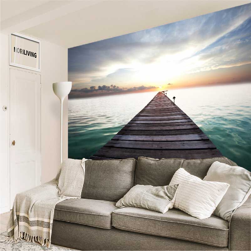 im Wohnzimmer eingebaute Wohnzimmerrückwand mit Motiv Holzsteg ins Meer 520