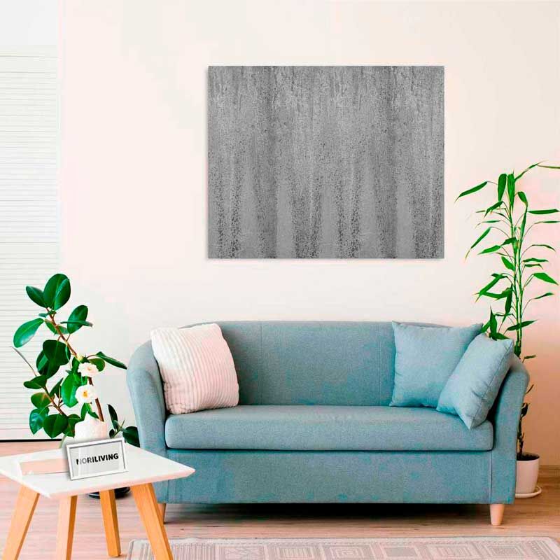 Modernes Wohnzimmer mit blauer Couch, grauem Wandbild und Zimmerpflanze