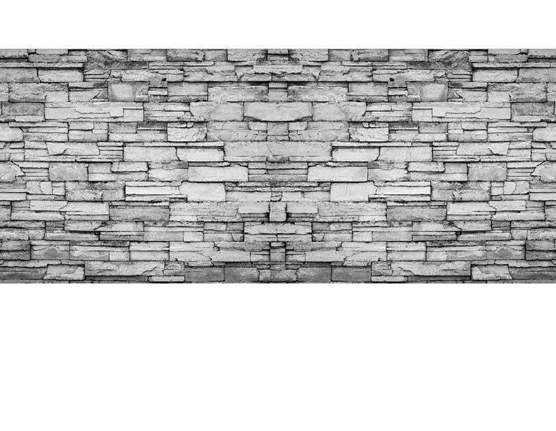 Detailansicht einer grauen Backsteinmauer im Schichtmuster