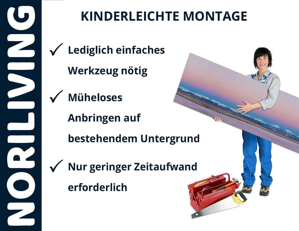 Person hält Panorama-Wandbild mit Anleitung zur kinderleichten Montage von Noriliving, nur einfaches Werkzeug notwendig
