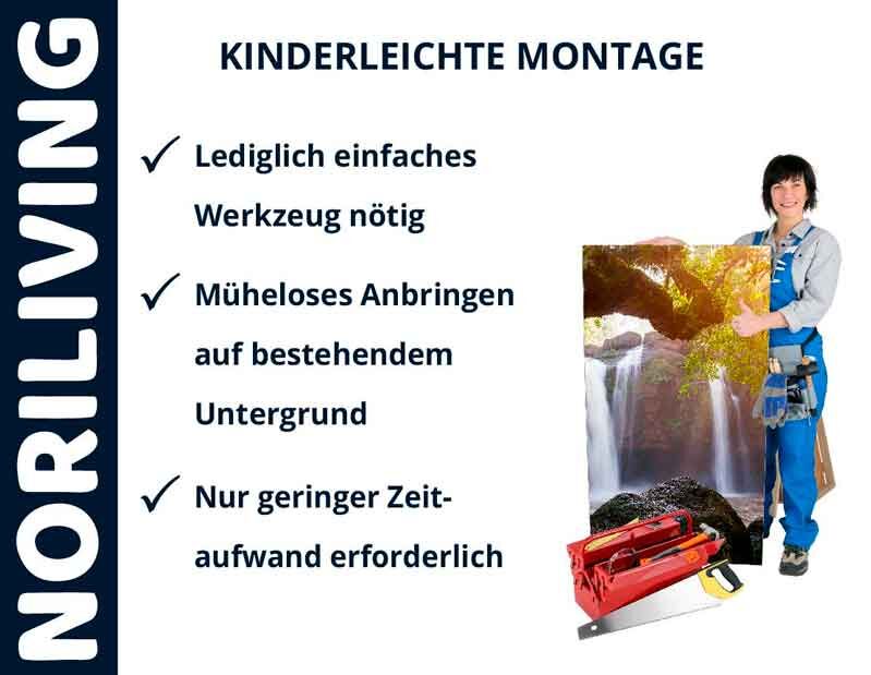 Frau zeigt einfache Montage von Wandbild mit Wasserfallmotiv, minimaler Werkzeugaufwand und Zeitbedarf